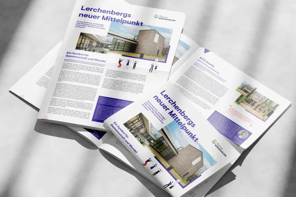 Zwei aufgeschlagene Magazine zeigen Artikel über das barrierefreie Bürgerhaus Mainz-Lerchenberg mit Fotos des Gebäudes und Texten zu Gemeinschaft und ECO-Events.